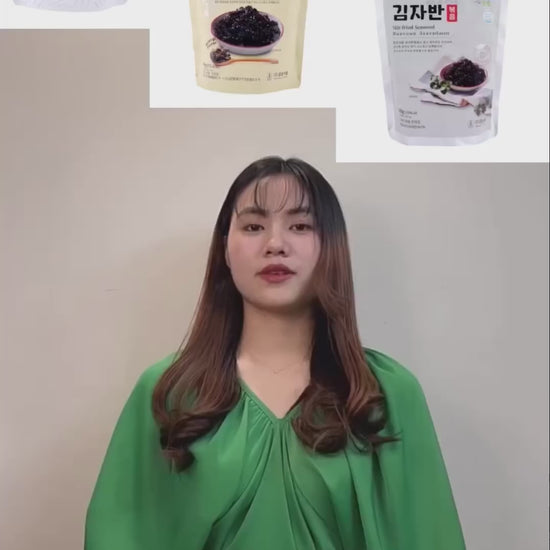 a woman standing in front of three bags of food